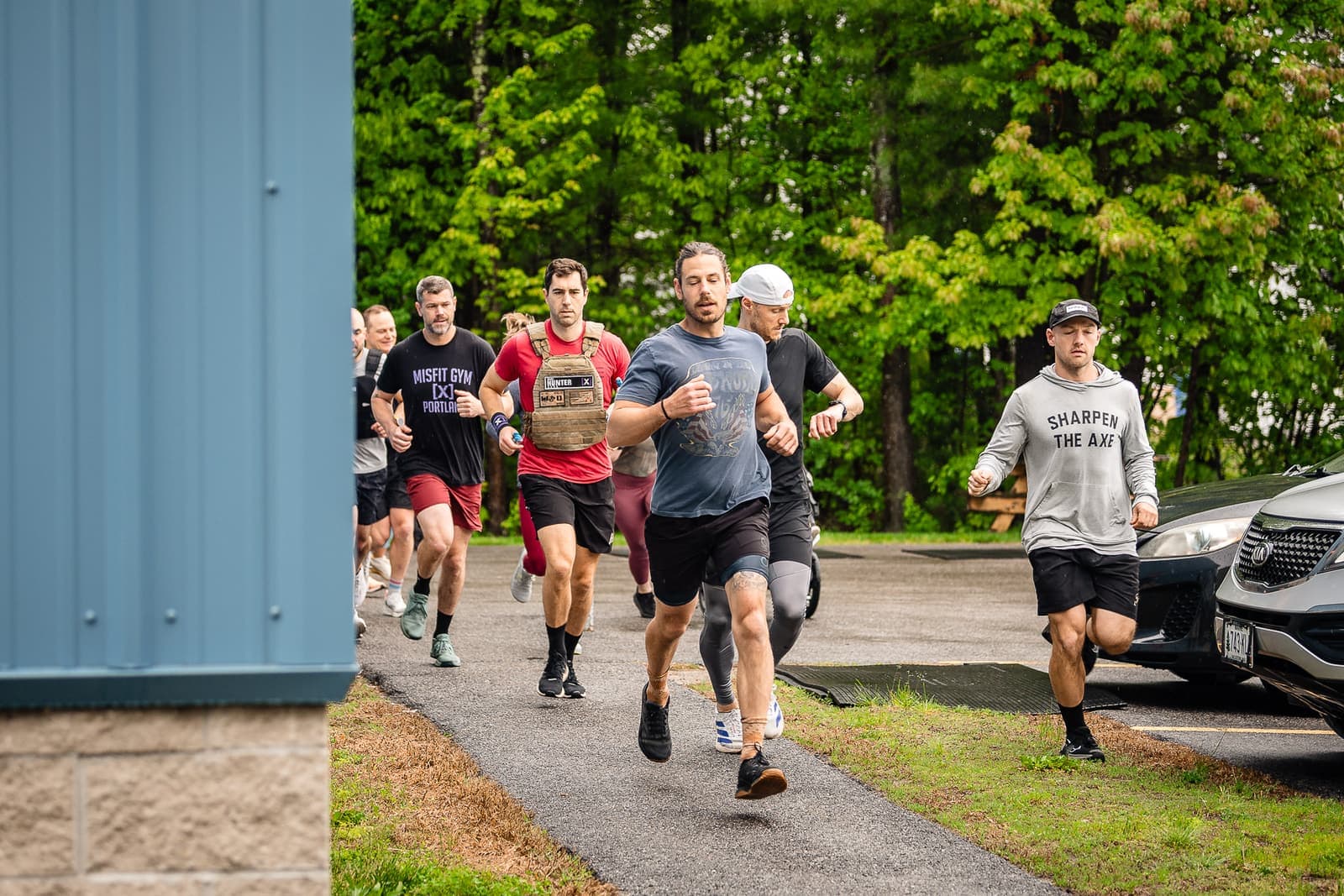 A big pack of Misfit members running together on the trail during Murph