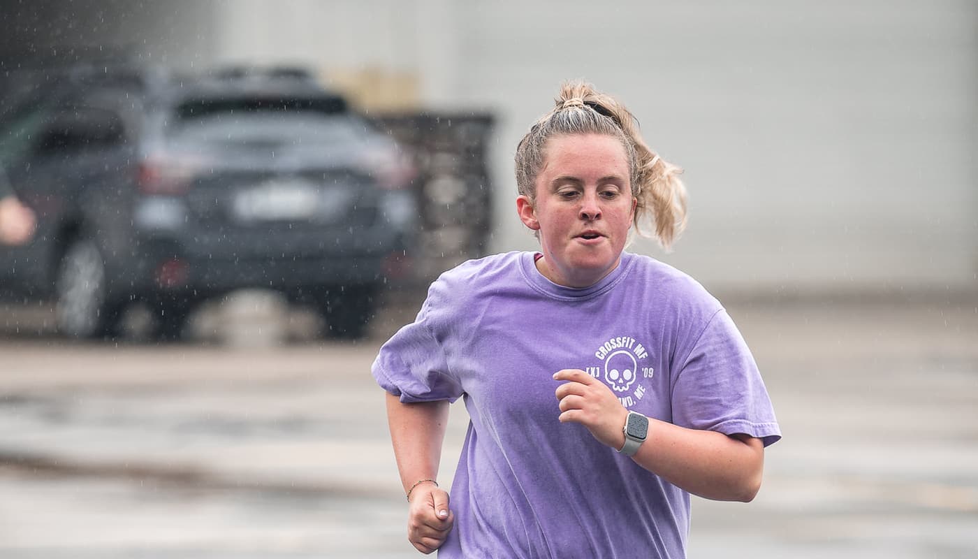 A Misfit member out running on the road in the rain