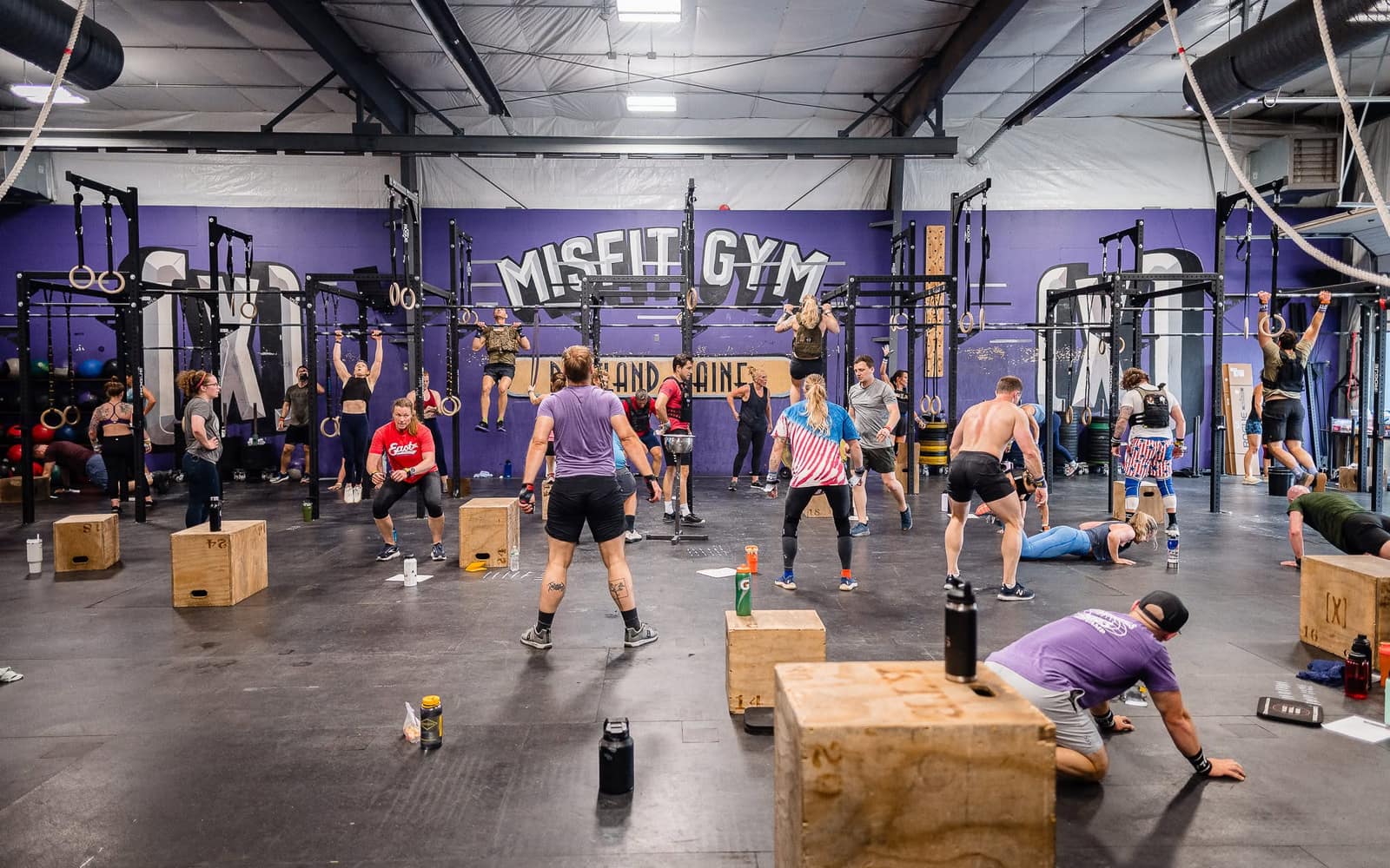 The CrossFit MF floor, rigs and equipment along the purple wall