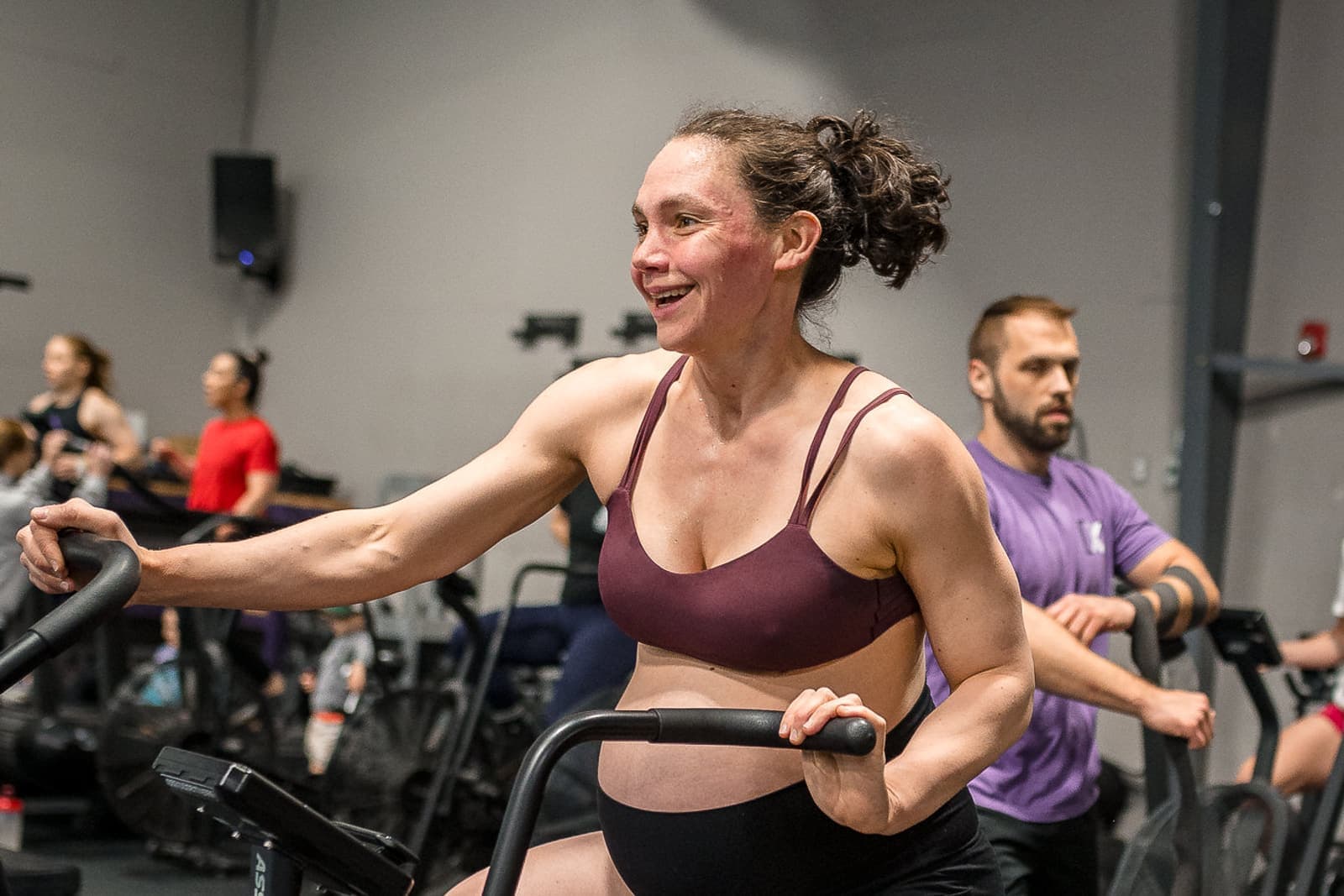 Misfit member deep in a conditioning piece on the assault bike